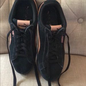 Rose gold and black suede pumas